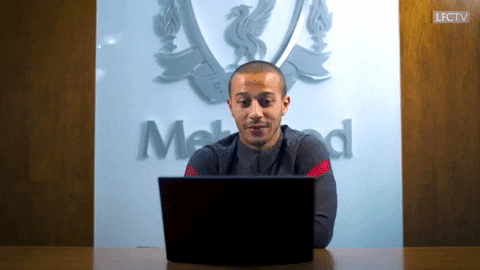 Man celebrating at a laptop