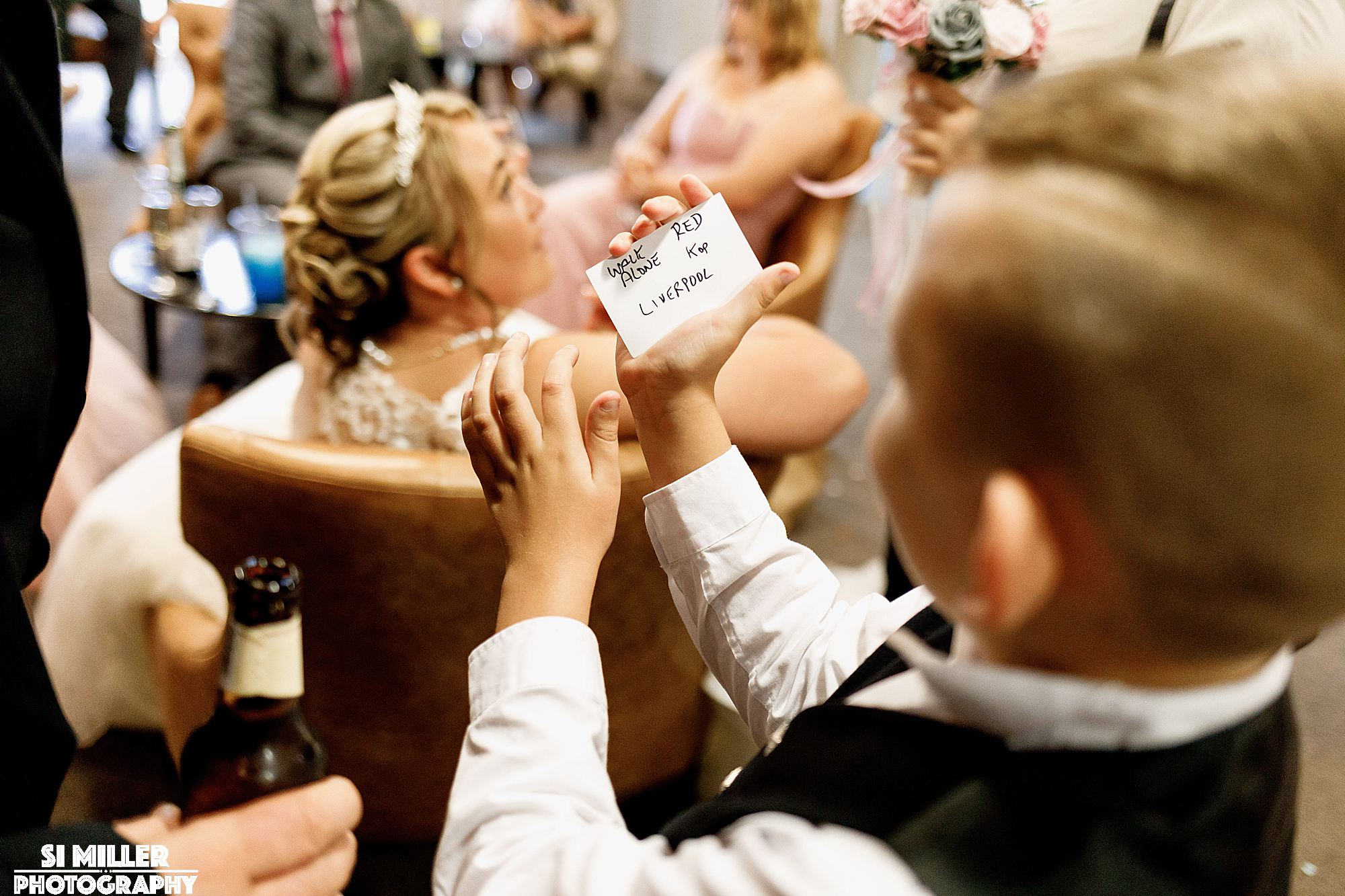 child holding a card